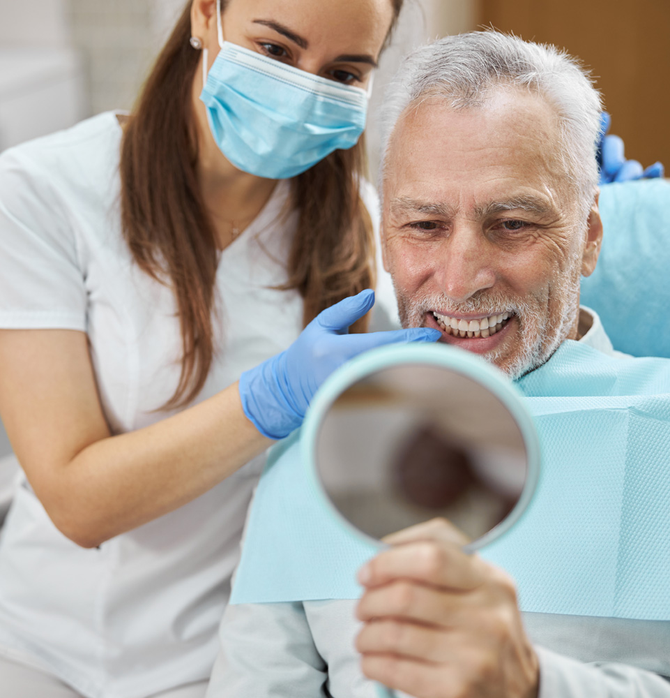 Patient smiling confidently after their dental procedure