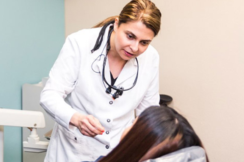 Doctor going over dental examination for dental procedure