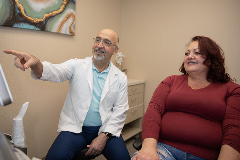 Doctor going over dental information with patient