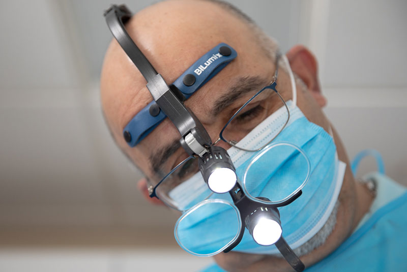 Doctor during guided dental surgery within the dental practice