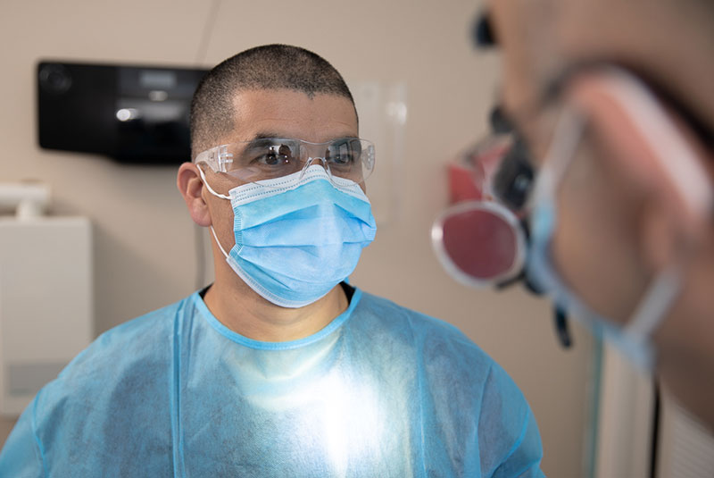 dental staff member assisting with dental guided surgery